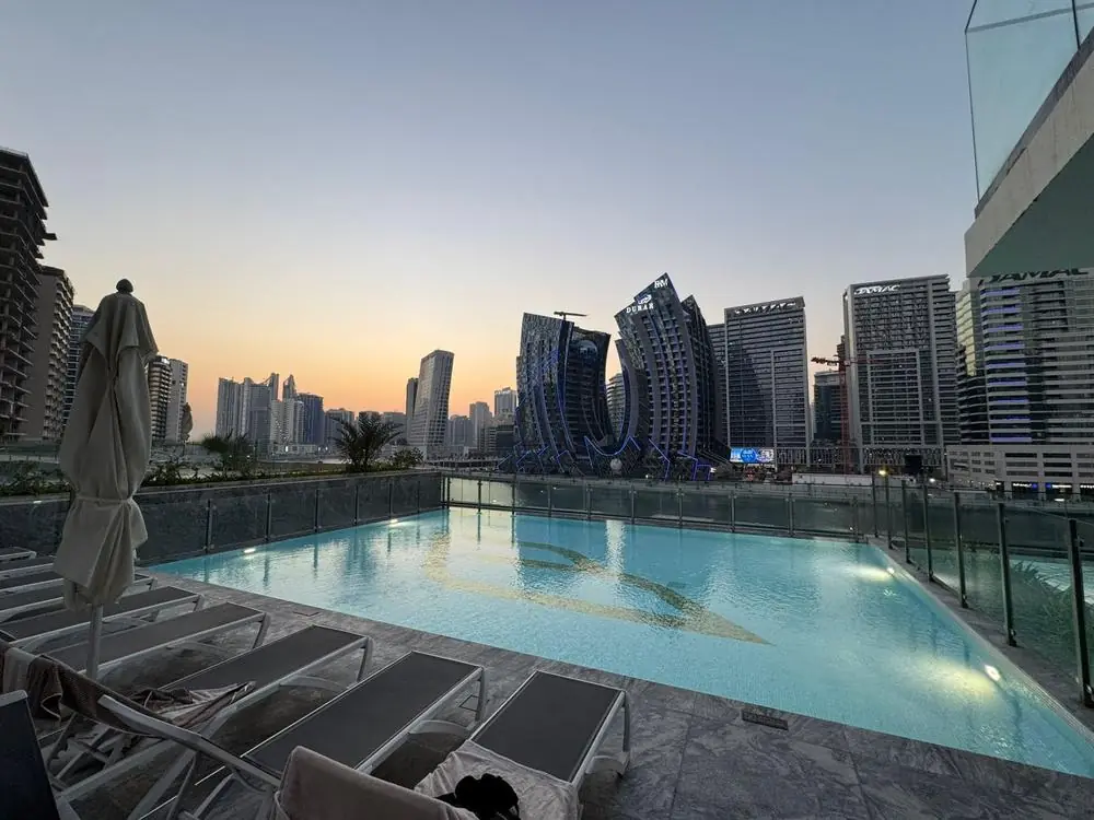 Binghatti Canal pool at sunset